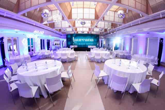 Granja room at Laureana Business Center, elegant conference space with round tables.