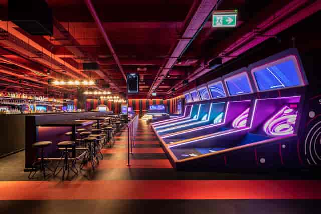 Putters Tech mini golf venue with vibrant lighting for corporate events and social gatherings.