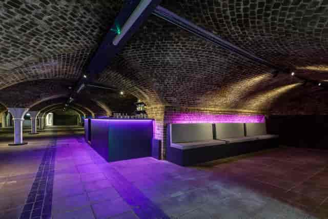 Underground venue with exposed brick arches, perfect for cocktail receptions and private parties.