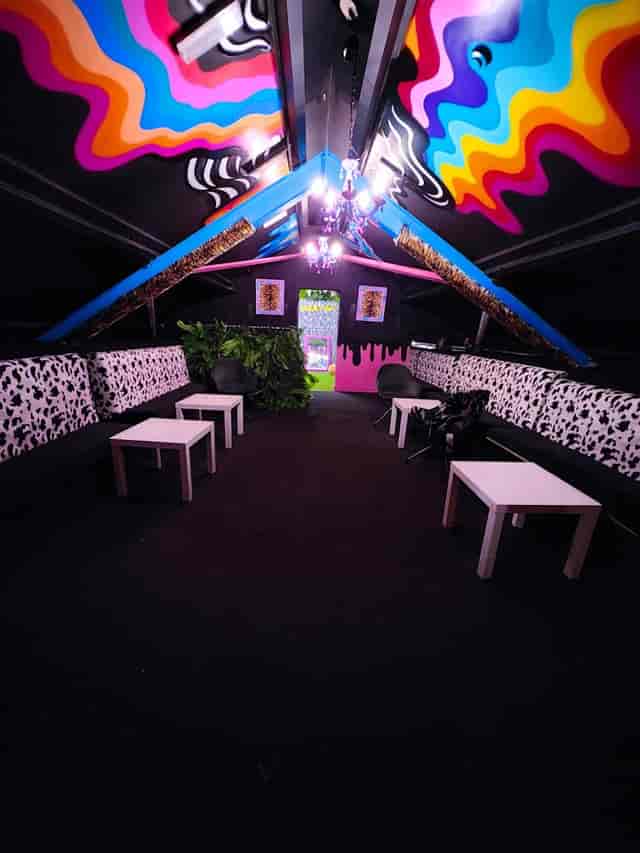 VIP area with balcony at BUNA Lounge, vibrant decor for networking events.