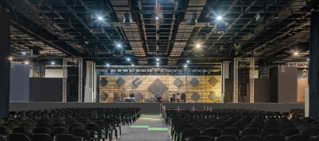 Spacious Hyatt Regency Rosebank ballroom with stage, ideal for conferences and performances.