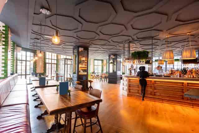 Modern Main Bar at Singer Tavern, ideal for meetings and events with cozy seating.