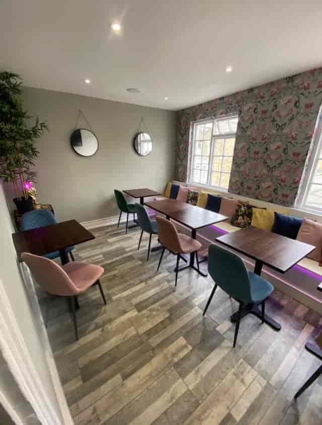 Cozy Railton Lounge venue with colorful chairs for workshops and team meetings.