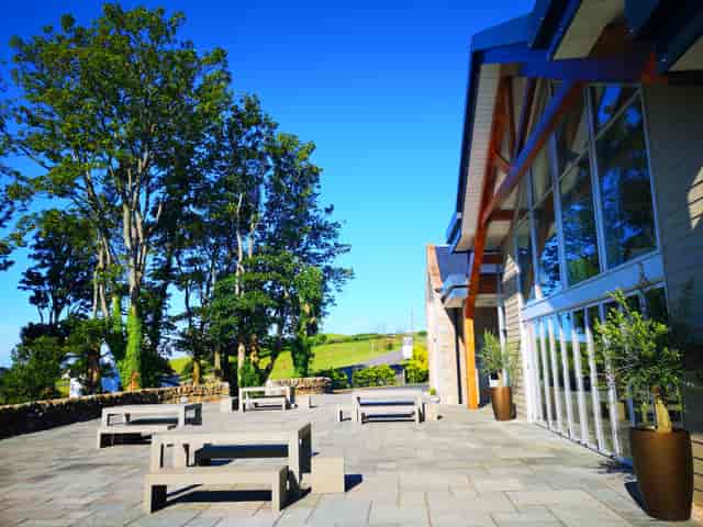 Ceremony Wing at GG's Yard: spacious outdoor venue with ample seating for events.