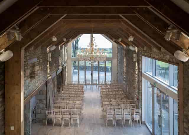 Ceremony Wing in GG's Yard: elegant wedding venue with high ceilings and natural light.
