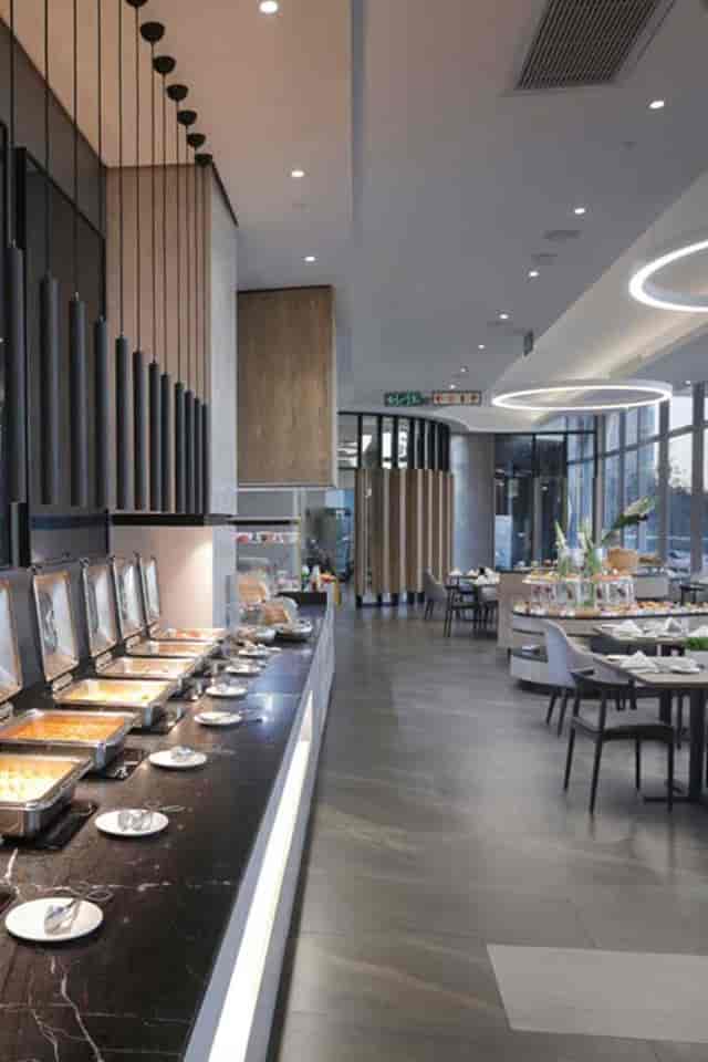 Modern event space at The Capital On The Park Hotel with buffet setup for corporate gatherings.