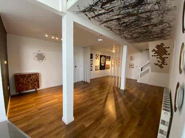 Industrial Loft Event Space in High Barnet with wooden flooring for creative gatherings.