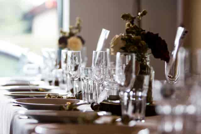 Elegant dining table at Rising Cafe, Anchor Point, perfect for formal events.