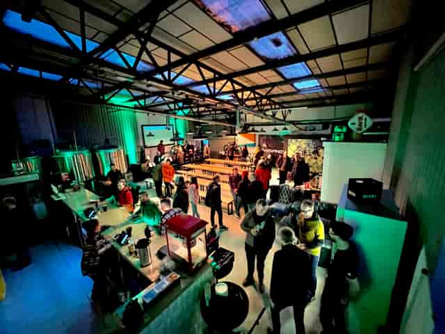 Brewery event space with vibrant attendees networking at Halton Turner Brewing Co.