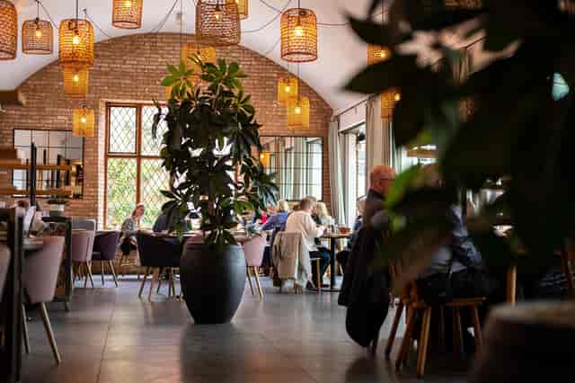 Stylish Coach House Kitchen venue with warm lighting for events and meetings.