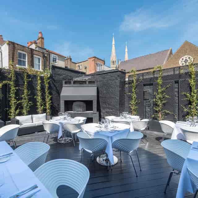 Stylish outdoor event space at Gaucho Hampstead, ideal for upscale gatherings and dining.