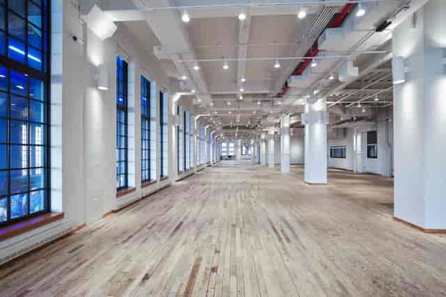 Spacious West Edge event venue with large windows, perfect for conferences and gatherings.
