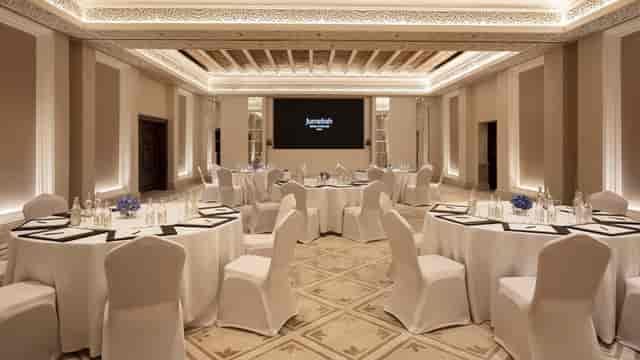 Majlis Al Salam event space with elegant round tables, ideal for meetings and gatherings.