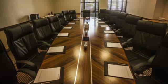 Conference room at Pivot Hotel Montecasino with polished table and leather chairs.