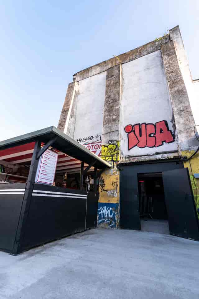 Vibrant urban venue with graffiti art, perfect for social gatherings and events.