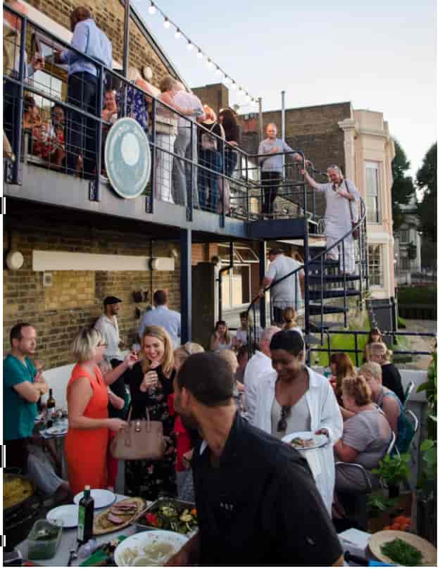 Trafalgar Rowing Centre terrace event with diverse attendees enjoying networking and socializing.