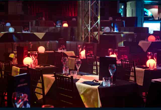 Elegant event space at Proud Embankment with ambient lighting for dining and networking.