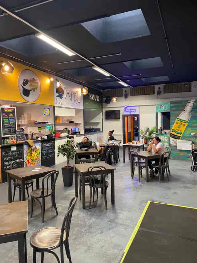 Casual dining space at The Post, vibrant decor for networking events and meetings.