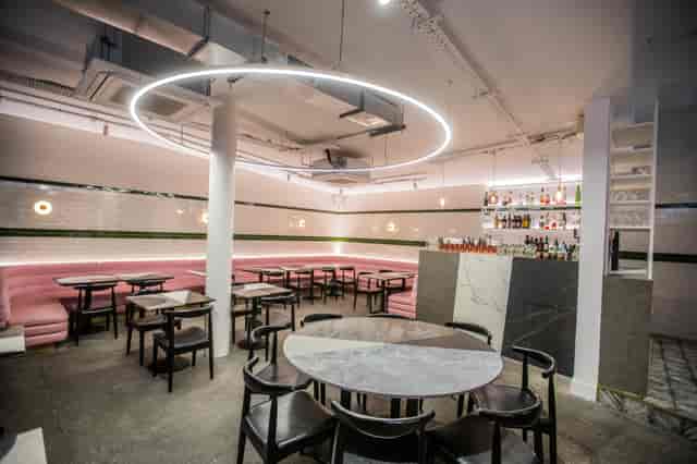 Modern lounge venue with circular lighting for intimate gatherings and cocktail events.