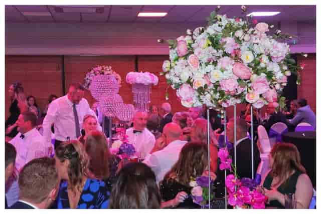 Elegant Events Hall with floral centerpieces, perfect for weddings and corporate events.