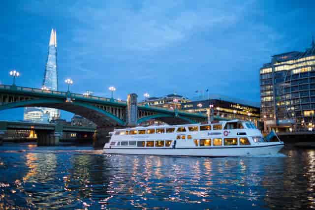 Sleek Silver Barracuda event boat on Thames, ideal for corporate gatherings and gala events.