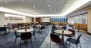 Versatile Market Suite meeting space with round tables for workshops and networking events.