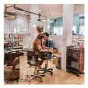 Cozy dog grooming at a pet care event in a welcoming restaurant setting.