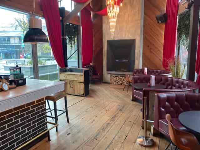 Stylish Impossible Main Bar with cozy seating, ideal for networking events and celebrations.