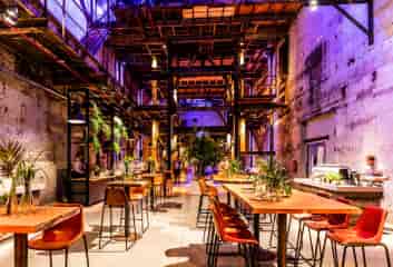 Spacious industrial venue with high ceilings for events in SugarFactory.