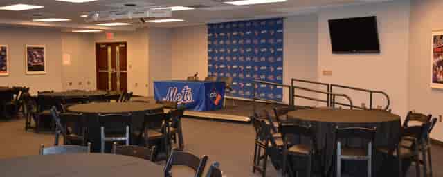 Press conference room at Citi Field with branded backdrop, ideal for corporate events.