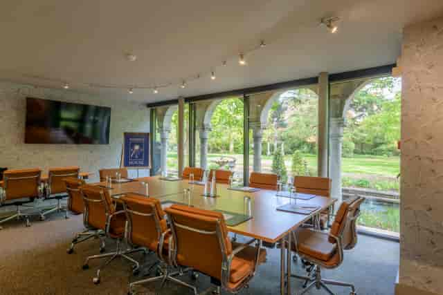 The Rose Room at Warren House Hotel: modern meeting space with natural light for corporate events.