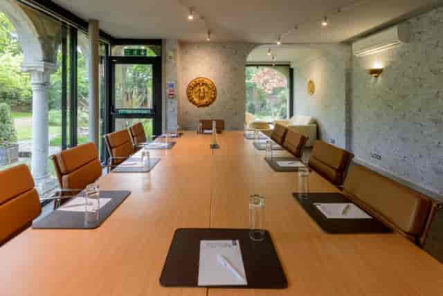 The Rose Room at Warren House Hotel, featuring a spacious table for corporate meetings.