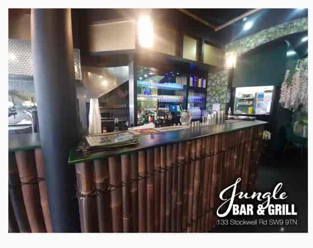 Vibrant bamboo bar setup at Jungle Bar & Grill, perfect for events and gatherings.