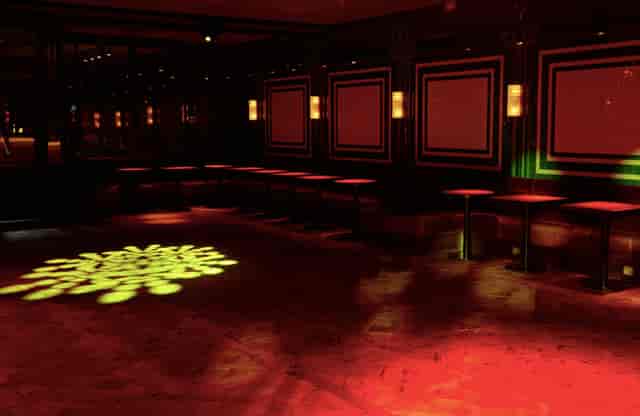 Stylish NEON194 Ballroom with red ambient lighting for networking and social events.