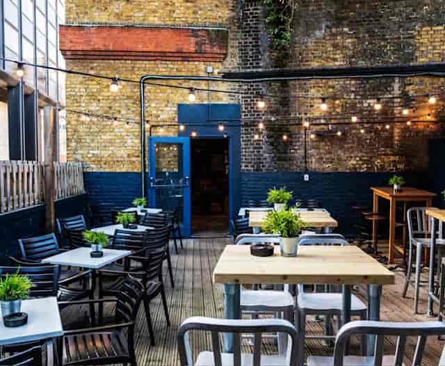 Outdoor venue at Auberge London with string lights, perfect for casual events and networking.