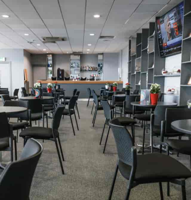 Matthew Le Tissier at Southampton FC event space, modern furnishings for networking.