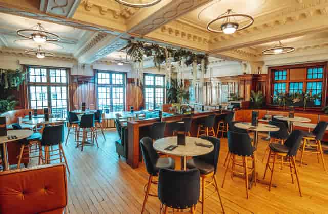 Elegant event space at Wonderbar, featuring natural light and versatile seating for gatherings.