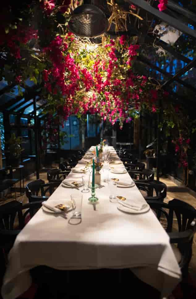 Elegant Wisteria dining space for upscale events with lush floral decor.