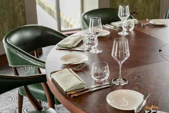 Elegant dining table setup for corporate meetings in Wagtail London, featuring glassware.
