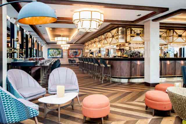Stylish 10th floor event space with elegant bar, ideal for networking and cocktail receptions.