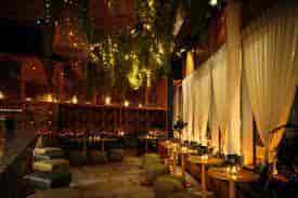 Stylish event space in Firefly City with warm lighting, ideal for networking and gatherings.
