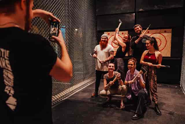 Group enjoying axe throwing at Whistle Punks for a fun team-building event.