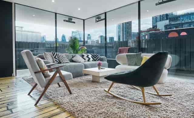 Modern lounge with large windows, ideal for networking events in Dream Factory.
