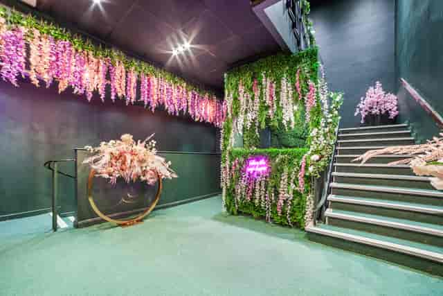 Gihon Suite entrance with lush greenery, ideal for events and gatherings.