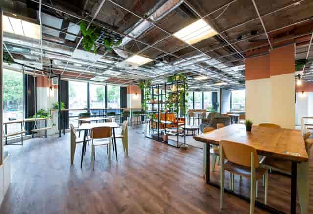 Steven in a modern event space with natural light, ideal for meetings and networking.