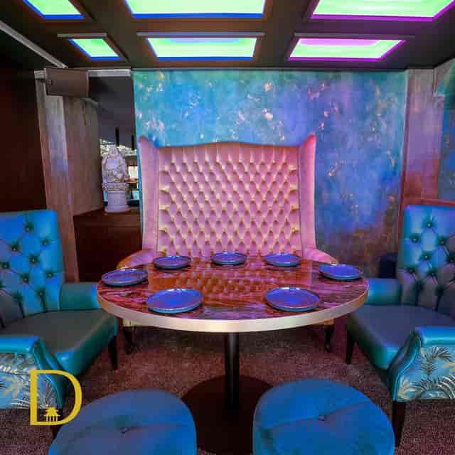 Stylish meeting space with tufted chair for intimate gatherings and brainstorming sessions.