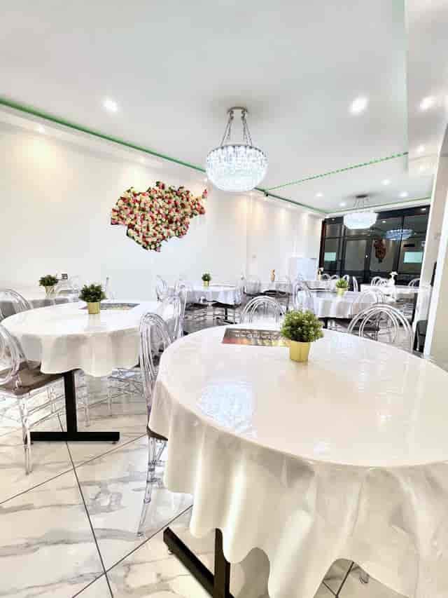 Modern Watandar Hall event space with elegant tables, ideal for gatherings and meetings.
