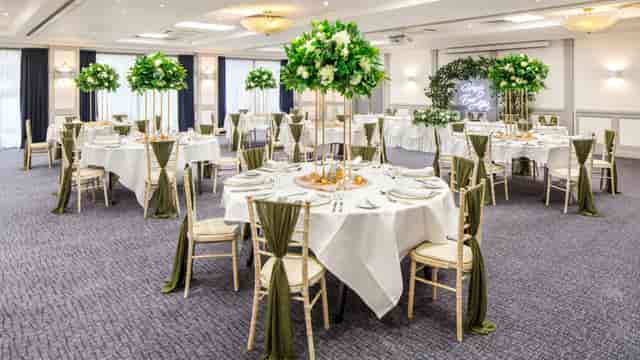 Nottingham Playhouse ballroom with gold accents for upscale wedding or banquet event.