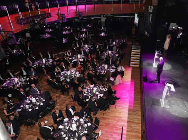 Gala event at The O2 with elegant tables and stage, perfect for networking and celebration.
