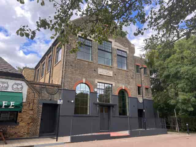 Hocking Hall venue with charming brick exterior, ideal for corporate events and workshops.
